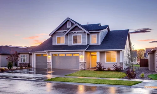 pexels-photo-186077-186077 Elegant suburban home with driveway at sunset showcasing modern architecture.